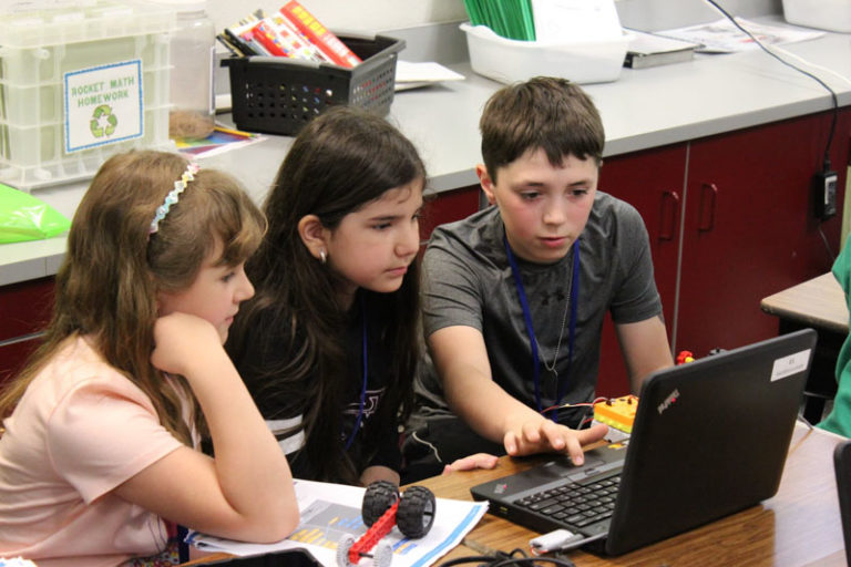 Group of Kids Discuss Coding